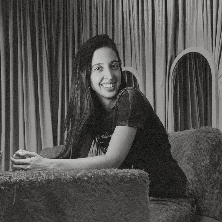 Cristina Lalinde smiling while seated in an armchair